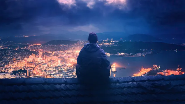 한 소년이 멀리서 도시의 아름다움을 바라보고 있습니다. 4K 배경화면