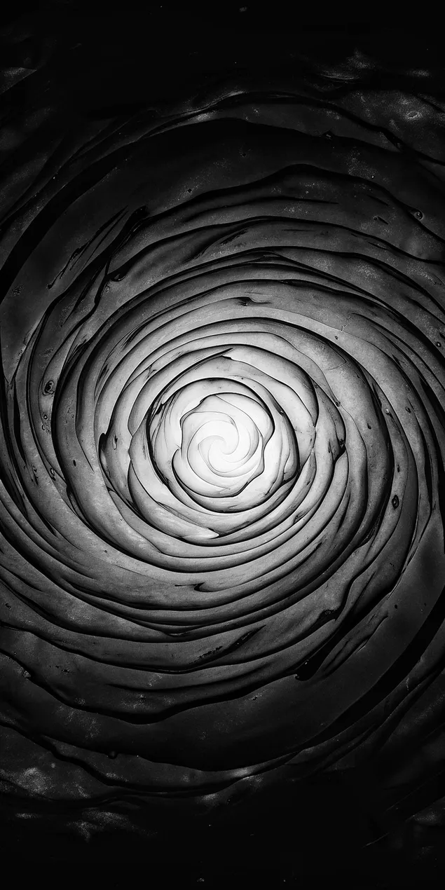 Een donkere, wervelende sterrenstelseltextuur met een helder centraal brandpunt 2K achtergrond