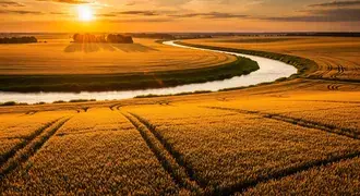 a golden river winds through abundant wheat fields at sunset, casting long shadows and creating a tranquil rural landscape glowing with rich colors download