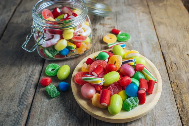 Un pot de diferents tipus de caramels 4K fons de pantalla