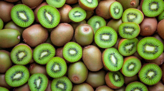 Un prim-plan vibrant al numeroaselor kiwi tăiate perfect 2K imagine de fundal