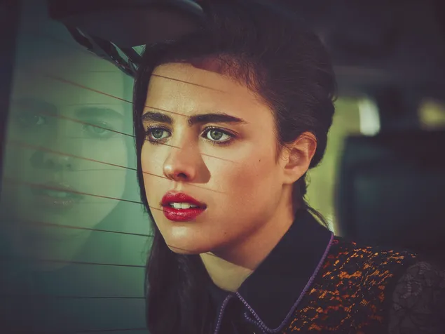 Actress Margaret Qualley lovely reflection in a car window