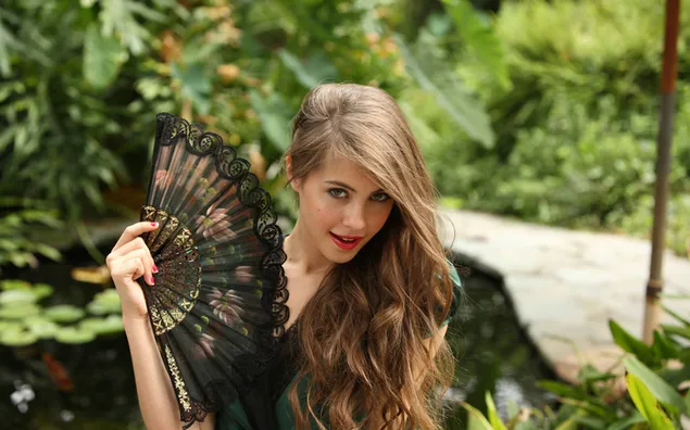 Actress Willa Hollland holding a fan