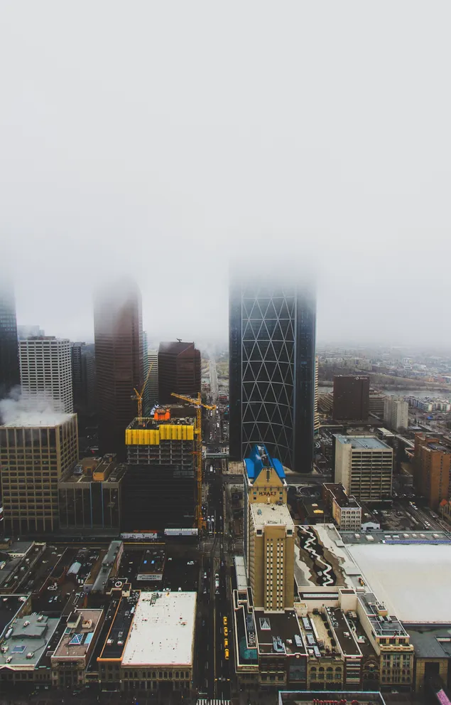 Aerial Photography of Buildings Under Cloudy Sky