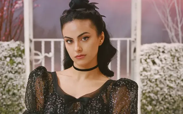 Alluring actress and singer Camila Mendes wearing a black dress  4K wallpaper