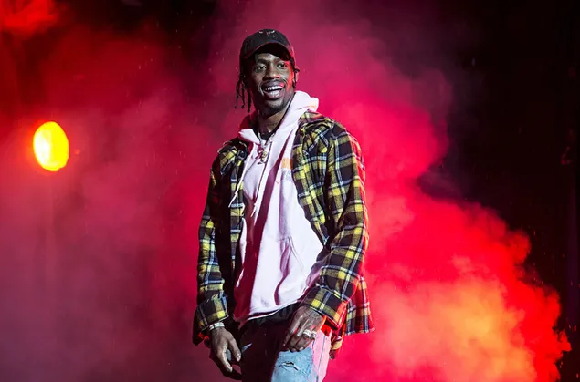 American rapper and producer Travis Scott on stage with colorful fog and lights