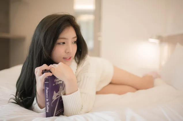 Asian girl holding a book  download