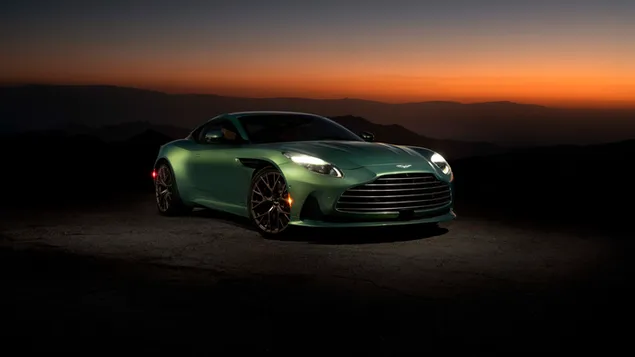 aston martin db12 se zelenou barvou a ocelovymi rafky v oblasti pohledu na zapad slunce stahnout