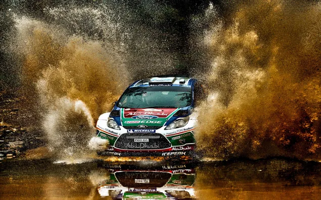 Awesome snapshot of the car descending from the mud road into the water in rally car races 2K wallpaper