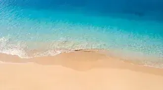 azure ocean waves gently wash on golden sandy beach top view download
