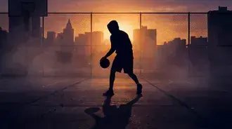basketball player silhouette against vibrant city sunset download