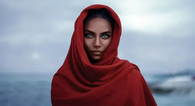 Beautiful girl with blue eyes wearing a red scarf 