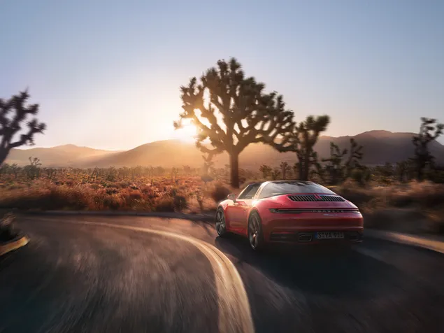 Hermosa puesta de sol naturaleza y Porsche rojo