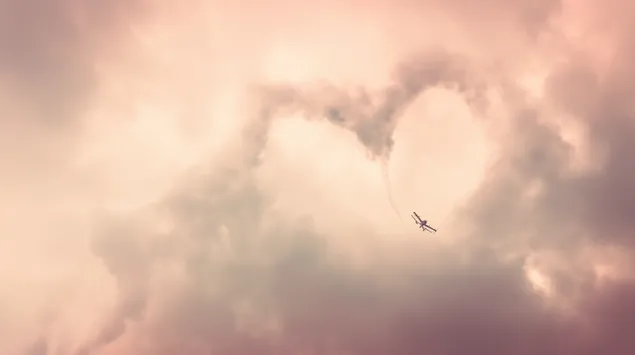 biplan skaber hjerteformet himmelskrift i skyer download