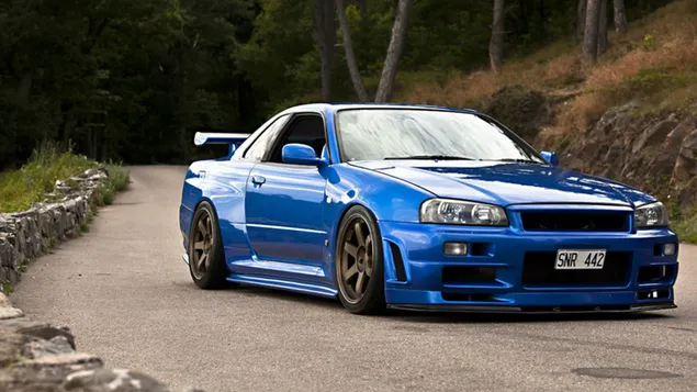 Blue nissan skyline gtr r34 on the forest road download