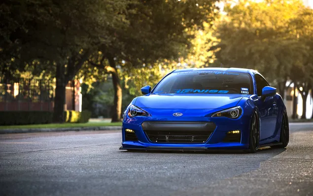 Blue Subaru BRZ parked on the road 4K wallpaper