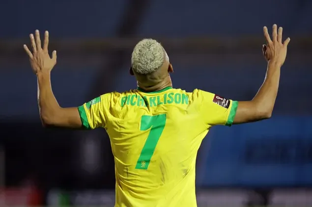Brazilian national team player Richarlison celebrates a goal with hands in the air