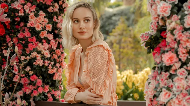 Brie Larson with amazingly colorful flowers background