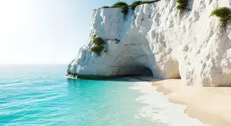 bright turquoise water meets soft sand and dramatic white cliffs, creating a stunning coastal retreat with a natural sea cave and lush greenery download