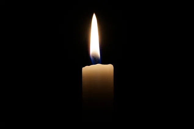 candle burning in front of black background download