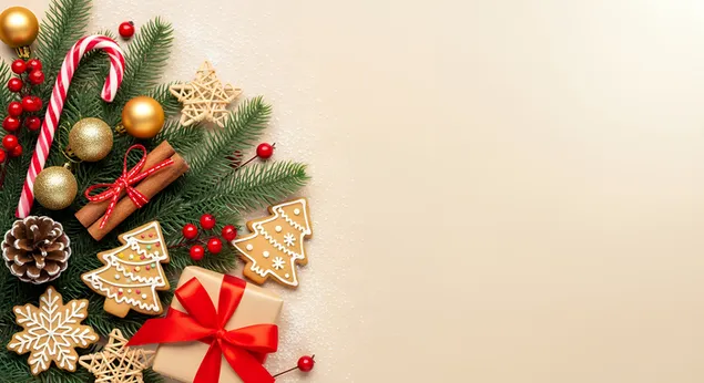 weihnachtliches stillleben mit tannenzweigen, ornamenten, zuckerstangen, geschenkkeksen und zimt. herunterladen