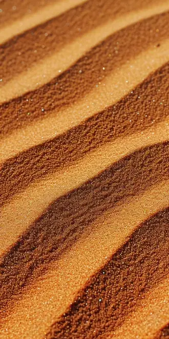 close up macro view of orange sand dunes with shimmering sparkles of light download
