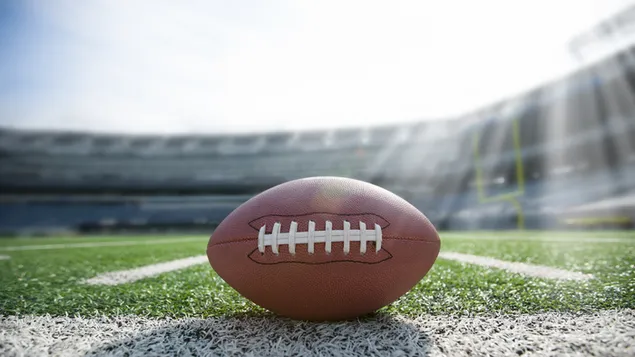 Taustpilt lähivõte jalgpallist üldisel staadionil 2K