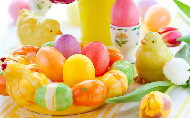 Colorful Easter egg with chicks figurines and flower