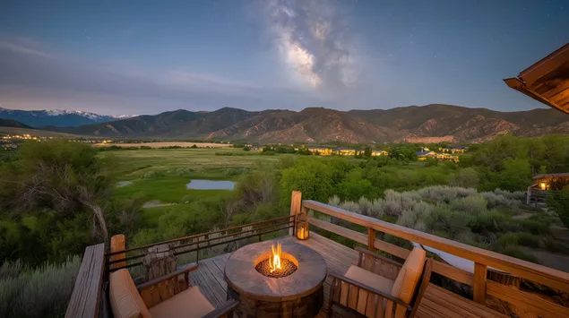 Удобно отворено огниште со поглед на планинската долина во самрак 2K тапет