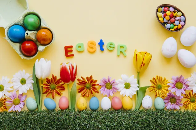 Creative Easter concept with variety of colorful flowers and eggs 