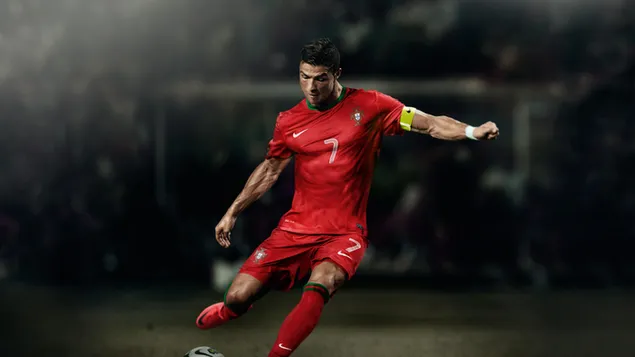 Cristiano Ronaldo nummer 7 draagt ​​de gele aanvoerdersband en de rode trui van het Portugese nationale team
