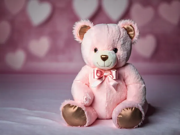 Cute and fluffy teddy bear with a gold bow tie for Valentines day with hearts in the background 4K wallpaper