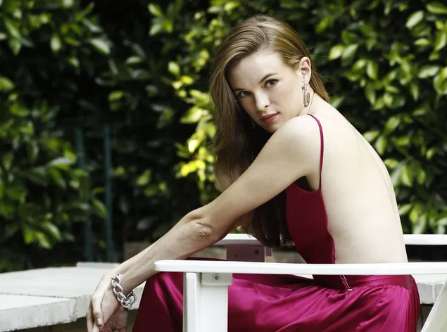 Danielle Panabaker dashing in pink backless dress