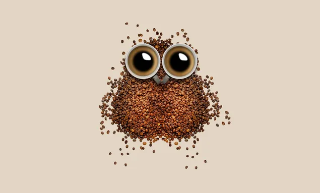 Dos tazas de café que parecen ojos, rodeadas de granos de café.