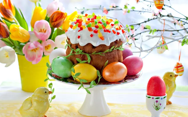 Easter cake with easter eggs on the side with colourful tulips