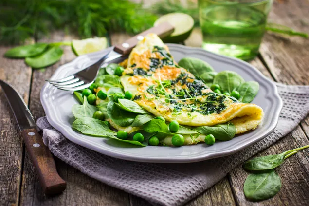 Egg omelet with spinach and pies on the side