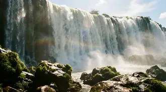 enchanting waterfall cave view: golden valley and river landscape download