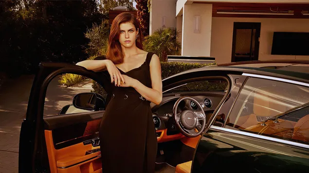 Fierce look Alexandra Daddario in a black car 