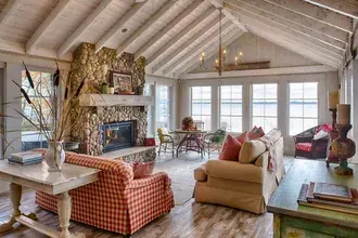 fireplace stonewall with sofa and table, chandelier