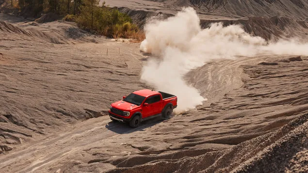 Ford Ranger Raptor stofweergave van bovenaf tijdens het rijden in de woestijn download