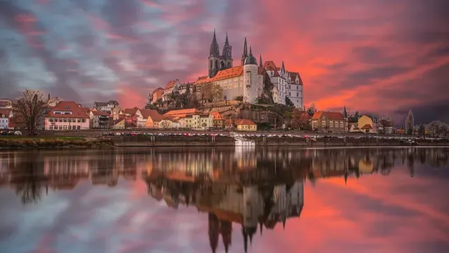 Germany city view reflected in lake water at sunset