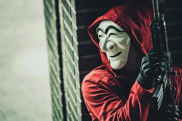 Páipéar balla Sracfhéachaint ar fhear maisc i gculaith dhearg le gunna sa scannán Money Heist Korea Joint Economic AreaHD