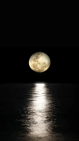 glowing full moon reflecting on the dark ocean waves during a calm night download