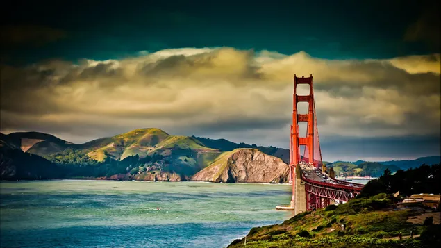 Golden gate bridge with a view where clouds and mountains meet 4K wallpaper