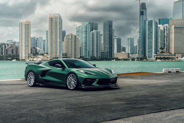 Green Corvette on city side 8K wallpaper