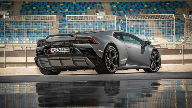 Grey Lamborghini on racing stadium 6K wallpaper