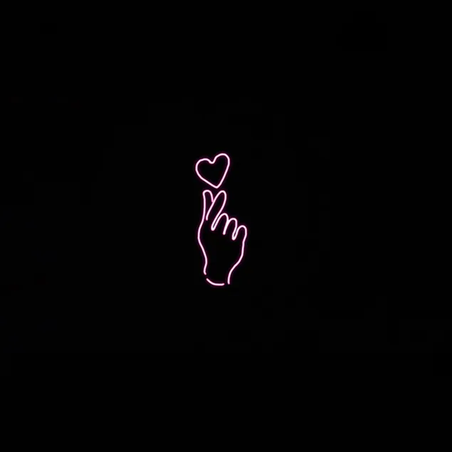 Hand made heart sign on black background download