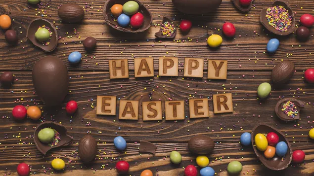 Happy easter presentation with colorful candies and chocolate shaped eggs