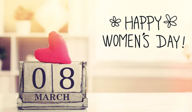 Happy Women's Day Schriftzug auf dem Tisch, 8. März auf dem Kalender und Herz darauf herunterladen