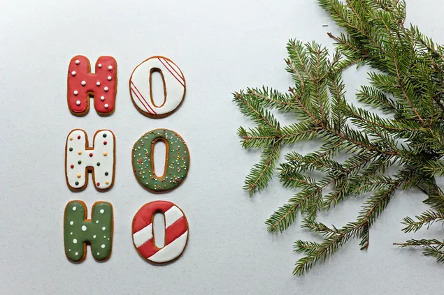 Ho ho ho Weihnachtsplätzchen und ein Kieferzweig 4K Hintergrundbild